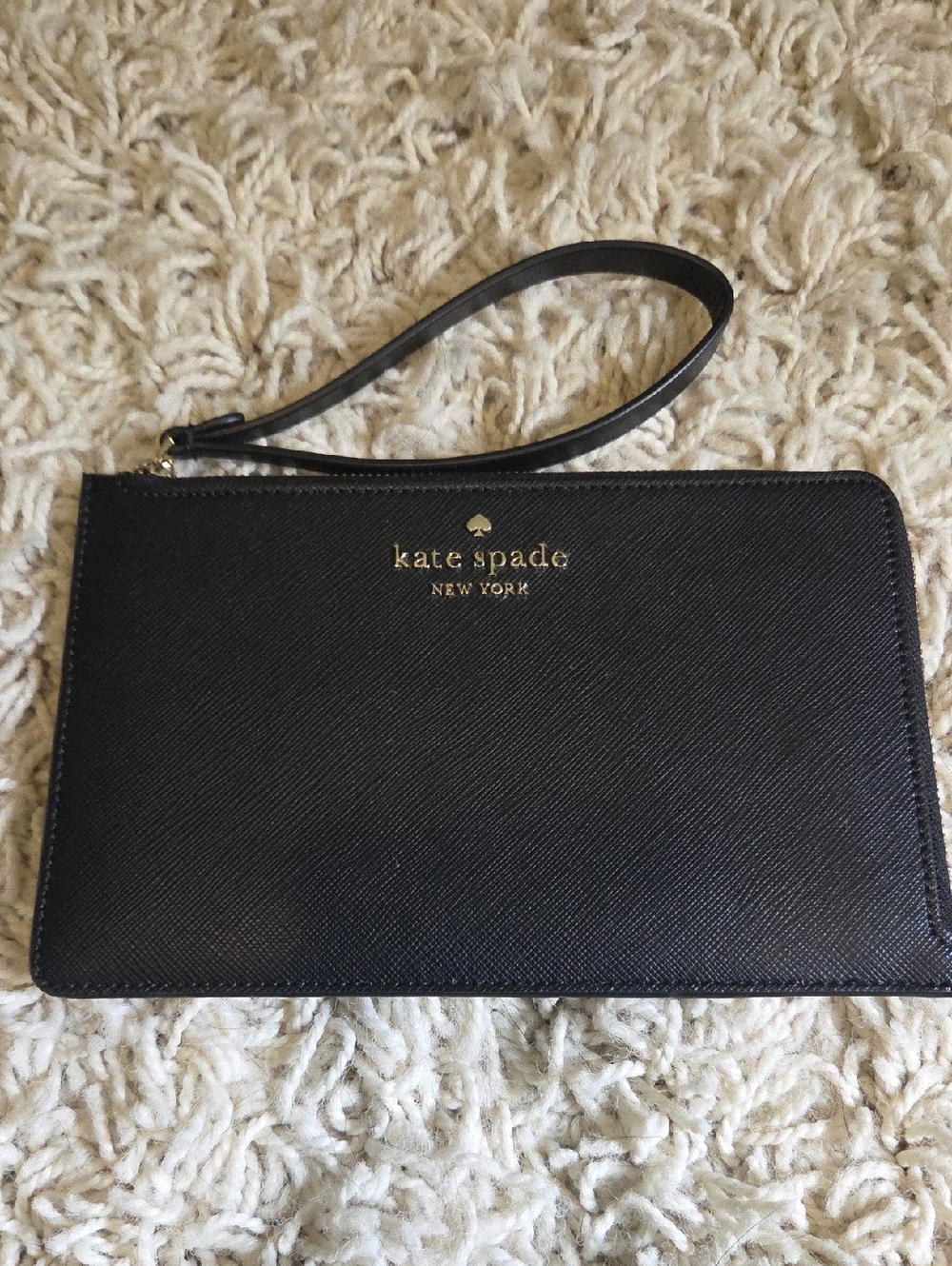 kate spade black leather wristlet with gold logo